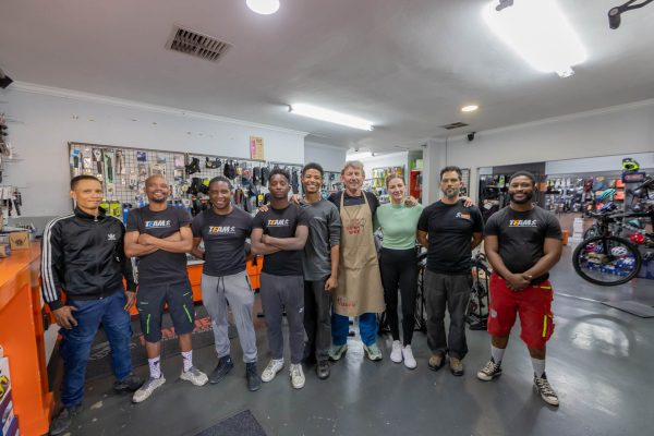 The team at Mannie's Bike Mecca posing in the workshop.